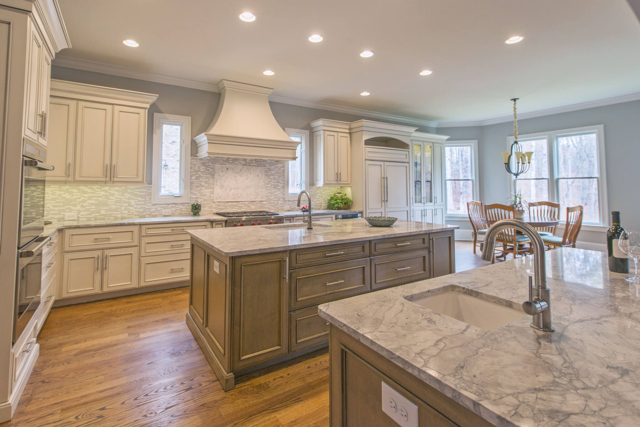 Double kitchen island with quartzite countertops by Cheryl Pett Design in Alpharetta.