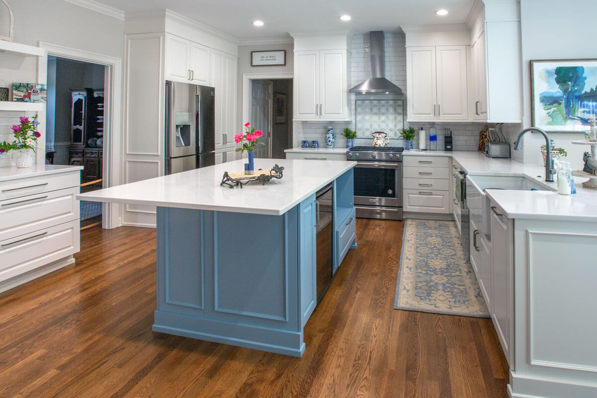 Cheryl Pett Designs: Sleek and Modern Blue Island in Kitchen Transformation